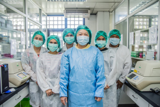 doctors in laboratory wearing masks